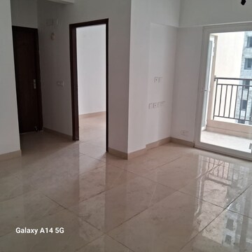 Living Room in 2 BHK Apartment at Amrapali Golf Homes, Sector 4, Greater Noida – for Sale