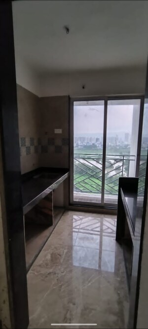 Kitchen in 1 BHK Apartment at Aastha River View, Taloja – for Sale