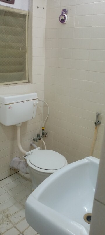 Bathroom in 1 BHK Apartment at Takshila CHS, Andheri East – for Rent