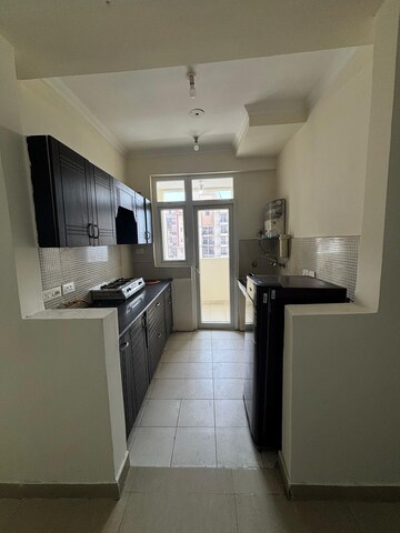 Kitchen in 3 BHK Apartment at Amrapali Silicon City, Sector 76 – for Rent