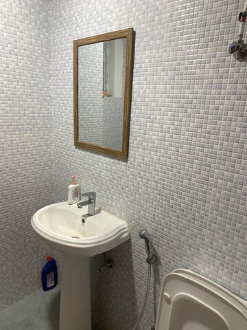 Bathroom in 2 BHK Apartment at Urban Axis Urban Woods, Sushant Golf City – for Rent