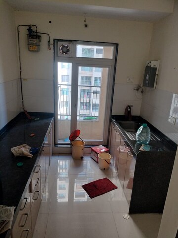 Kitchen in 2 BHK Apartment at Rustomjee Azziano Wing I, Majiwada – for Rent