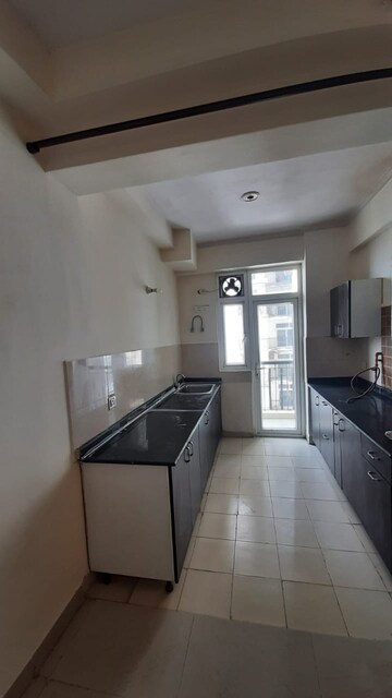 Kitchen in 3.5 BHK Apartment at Amrapali Zodiac, Sector 120 – for Rent