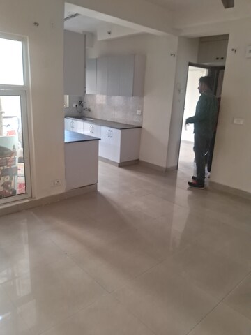 Living Room in 2.5 BHK Apartment at Aims Golf City, Sector 75 – for Rent