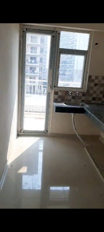 Kitchen in 2 BHK Apartment at Shree Vardhman Green Court, Sector 90 – for Rent