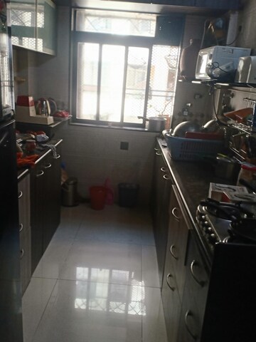 Kitchen in 1 BHK Apartment at Dheeraj Uphar CHS. LTD., Malad East – for Rent