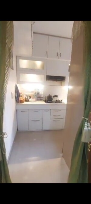 Kitchen in 2 BHK Apartment at Uninav Heights Phase I, Raj Nagar Extension – for Sale