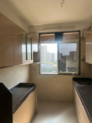 Kitchen in 2.5 BHK Apartment at Navnit CHS, Andheri West – for Sale