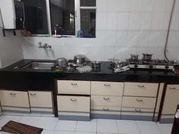 Kitchen in 3 BHK Apartment at Nirmiti Sanket, Paud Road – for Rent