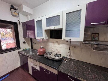 Kitchen in 2 BHK Apartment at Westin Karmayog CHS, Andheri West – for Rent