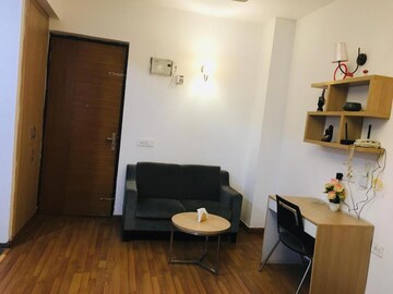 Living Room in Studio Apartment at Nimbus The Golden Palm, Sector 168 – for Sale