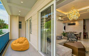 Living Room in 3 BHK Apartment at Motia Blue Ridge, Dhakoli Village – for Sale