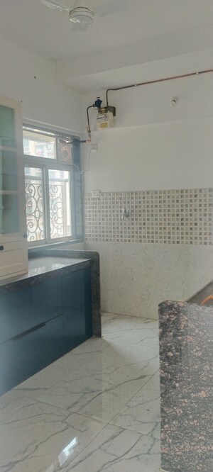 Kitchen in 3 BHK Apartment at New Happy Life CHS, Mulund West – for Sale