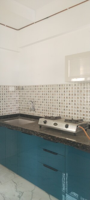 Kitchen in 3 BHK Apartment at New Happy Life CHS, Mulund West – for Sale