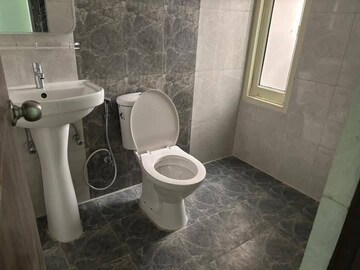 Bathroom in 2 BHK Apartment at JKG Palm Court, Sector 16c Greater Noida – for Rent