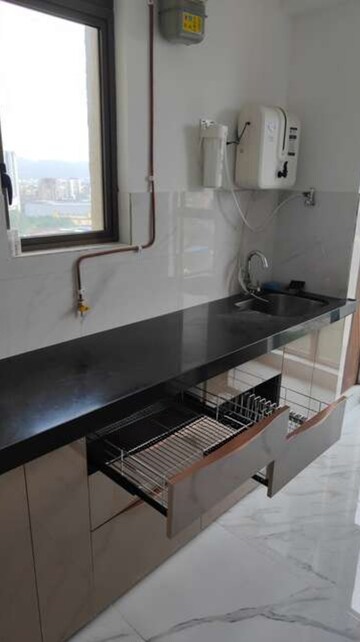 Kitchen in 2 BHK Apartment at Raymond Ten X Habitat, Pokhran Road No 2 – for Rent