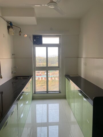 Kitchen in 1 BHK Apartment at Puranik City Reserva, Ghodbunder – for Rent