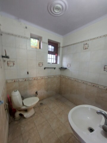 Bathroom in 3 BHK Apartment at Ashok Vihar – for Rent