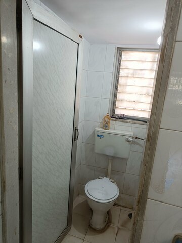 Bathroom in 1 BHK Apartment at Vrushali Shilp CHS, Borivali West – for Sale