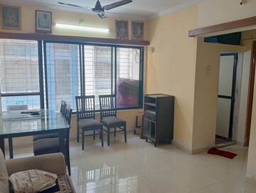 Living Room in 1 BHK Apartment at Bindra Complex, Andheri East – for Rent