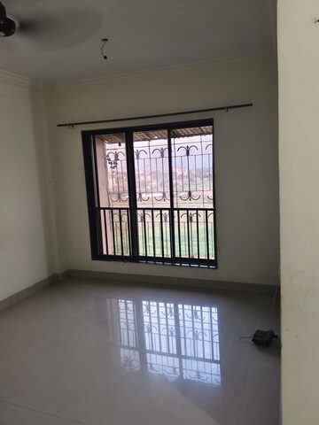 Room in 2 BHK Apartment at Rajhans Seasons, Vasai West – for Rent
