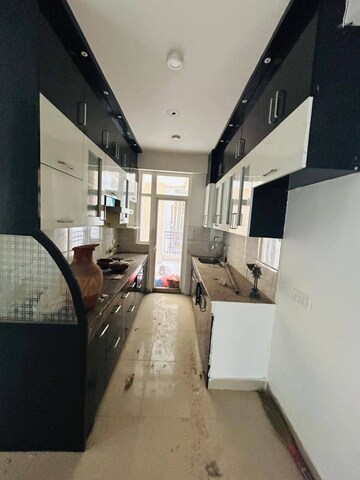 Kitchen in 3 BHK Apartment at Ajnara Le Garden, Sector 16b Greater Noida – for Rent