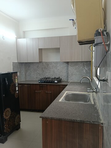 Kitchen in 3 BHK Apartment at Mahagun Mywoods, Sector 16c Greater Noida – for Rent