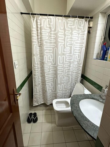 Bathroom in 2 BHK Apartment at Ambience Island, Sector 24 – for Sale