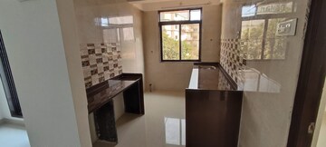 Kitchen in 2 BHK Apartment at Raj Tulsi Aawas, Badlapur East – for Sale