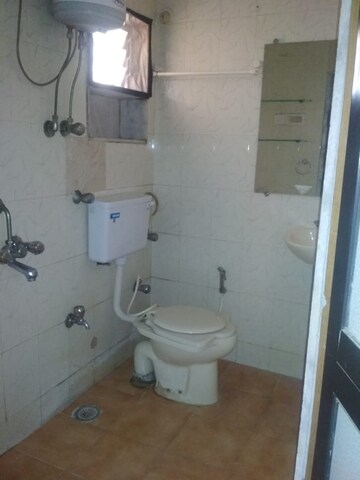 Bathroom in 3 BHK Apartment at Aruna Smruti Apartment, Borivali East – for Rent