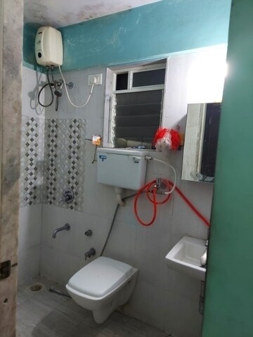 Bathroom in 1 BHK Apartment at Raunak Bliss, Ghodbunder Road – for Rent