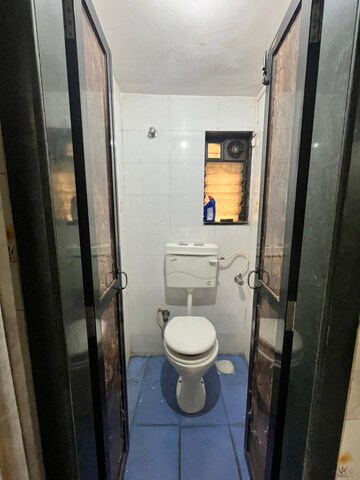 Bathroom in 1 BHK Apartment at Dak Sangathan CHS, Malad East – for Rent