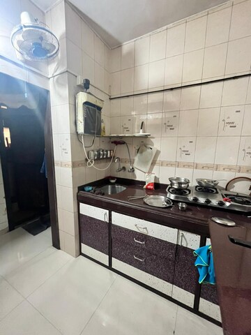 Kitchen in 1 BHK Apartment at Dak Sangathan CHS, Malad East – for Rent