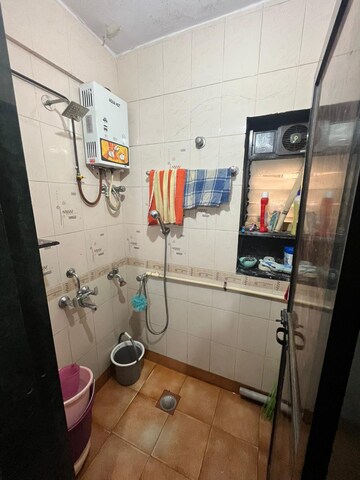 Bathroom in 1 BHK Apartment at Dak Sangathan CHS, Malad East – for Rent