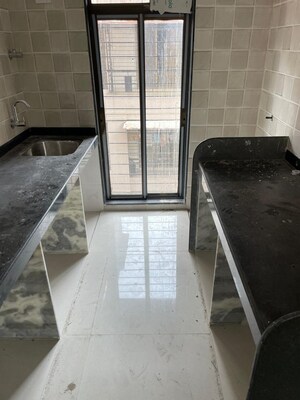 Kitchen in 2 BHK Apartment at Navkar Sakshat Navkar, Borivali West – for Sale