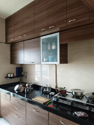 Kitchen in 1 BHK Apartment at Raunak Heights, Ghodbunder Road – for Rent