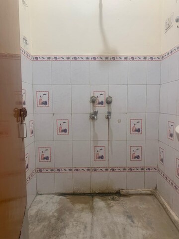 Bathroom in 2 BHK Apartment at RWA Qutab Enclave, Katwaria Sarai – for Rent
