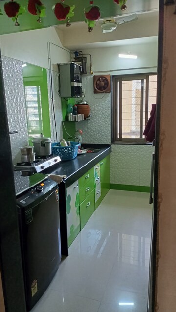 Kitchen in 2 BHK Apartment at Sudarshan Sky Garden, Ghodbunder Road – for Sale