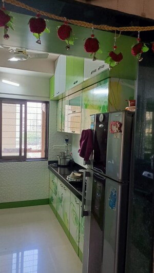 Kitchen in 2 BHK Apartment at Sudarshan Sky Garden, Ghodbunder Road – for Sale