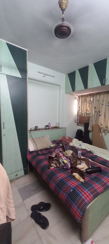 Bedroom in 2 BHK Apartment at Satellite Garden, Goregaon East – for Rent
