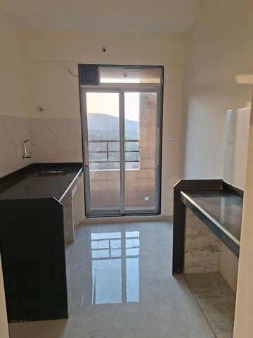 Kitchen in 1 BHK Apartment at Mahavir Kalpavruksha, Ghodbunder Road – for Rent