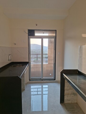 Kitchen in 1 BHK Apartment at Mahavir Kalpavruksha, Ghodbunder Road – for Rent