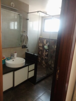 Bathroom in 4 BHK Apartment at Raja Park – for Sale