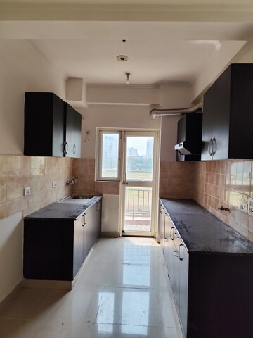 Kitchen in 2 BHK Apartment at Aims Golf City, Sector 75 – for Rent
