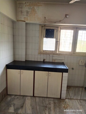 Kitchen in 2 BHK Apartment at Sanjeev Enclave, Andheri West – for Sale
