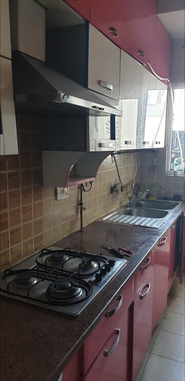 Kitchen in 3 BHK Apartment at Mahagun Moderne, Sector 78 – for Sale