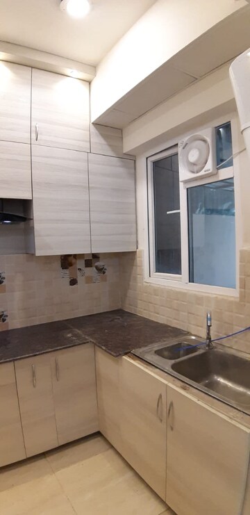 Kitchen in 2 BHK Apartment at Gaur City 7th Avenue, Sector 4, Greater Noida – for Rent