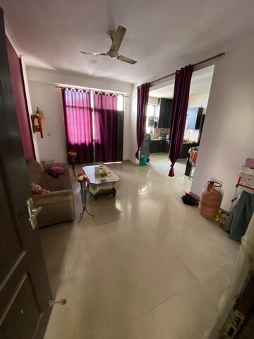 Living Room in 2.5 BHK Apartment at SVP Gulmohur Garden, Raj Nagar Extension – for Sale
