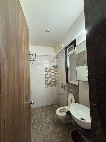 Bathroom in 1.5 BHK Apartment at Ravinanda Skylights, Wagholi – for Sale