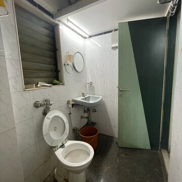 Bathroom in 2 BHK Apartment at Satellite Garden, Umershetpada – for Rent